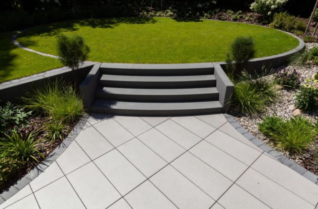 A circular lawn framed by paved steps