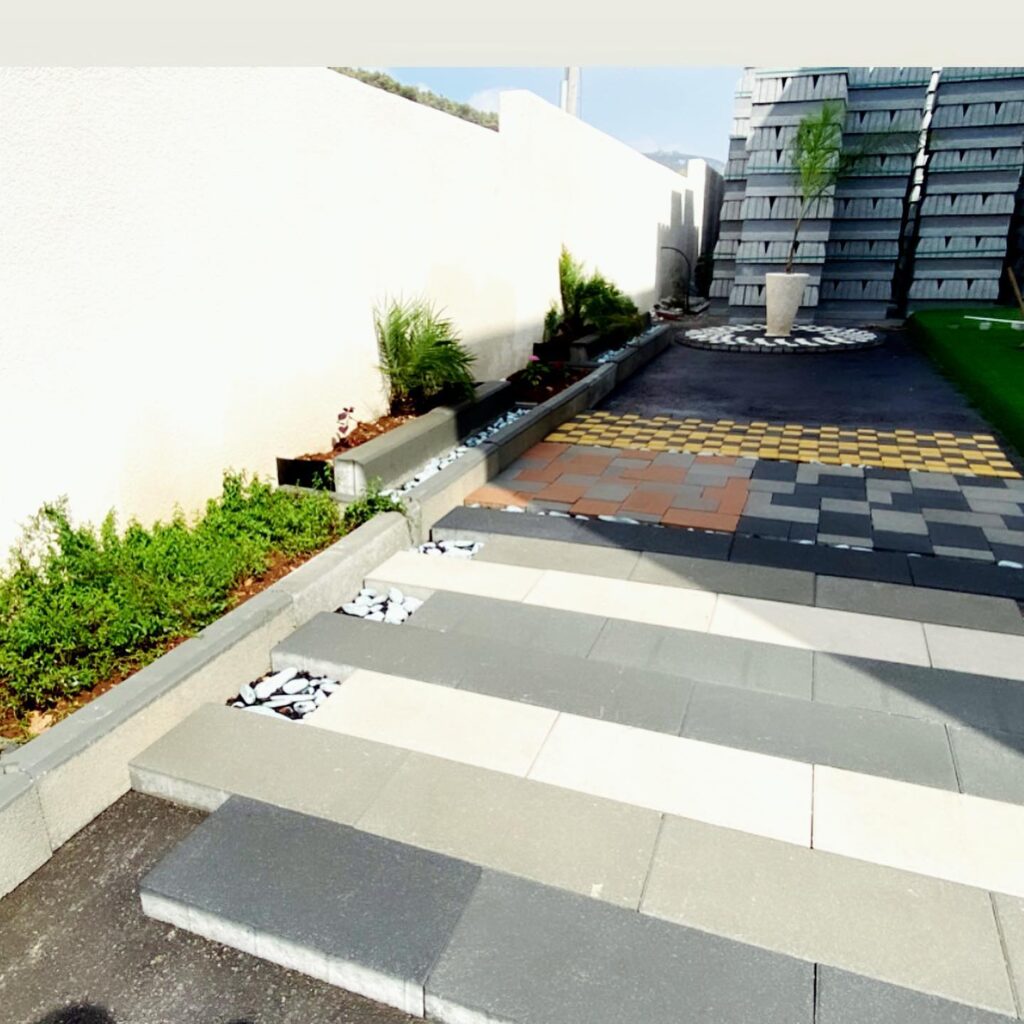 Production yard with stacked paving stone and mosaic circle